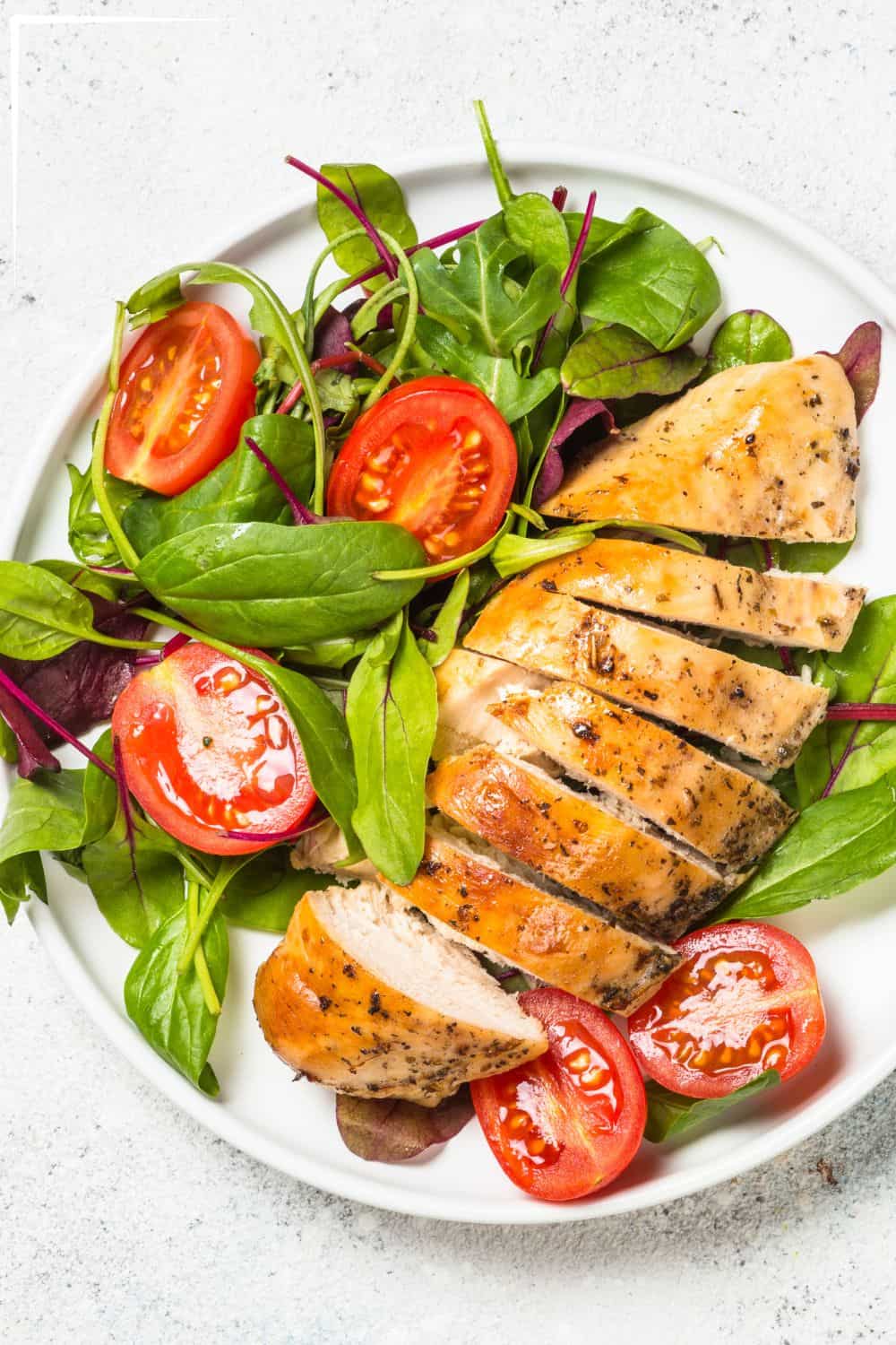 A plate of chicken and salad.